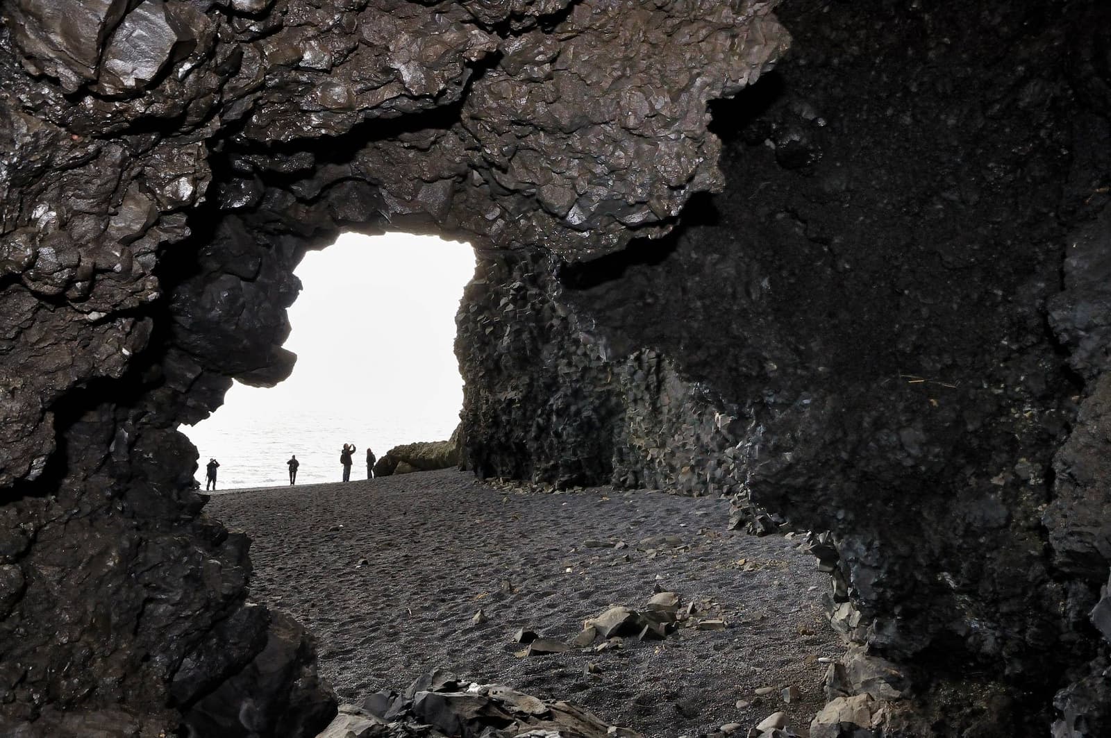 Surf and basalt cliffs around Halsanefshellir Cave at Reynisfjara