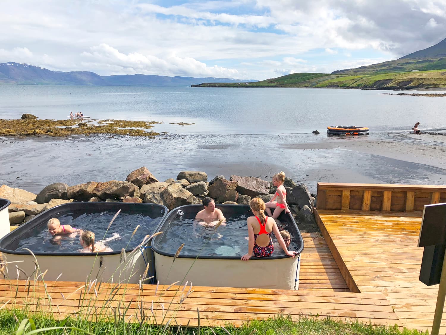 Hot tubs beside the black beach in Hauganes looking out across Eyjafjörður
