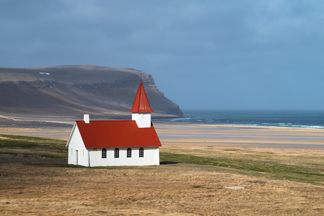 Breiðavík church and beach on the nearby route beyond Örlygshöfn in the southern Westfjords.