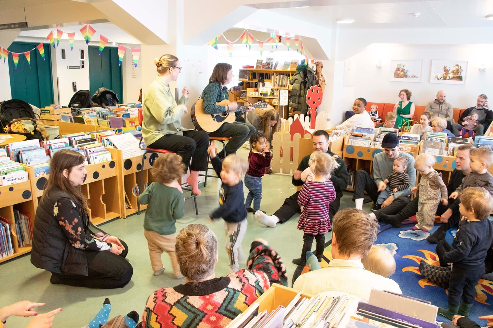 Families gathered in the children's area at Reykjavik City Library Grófin.