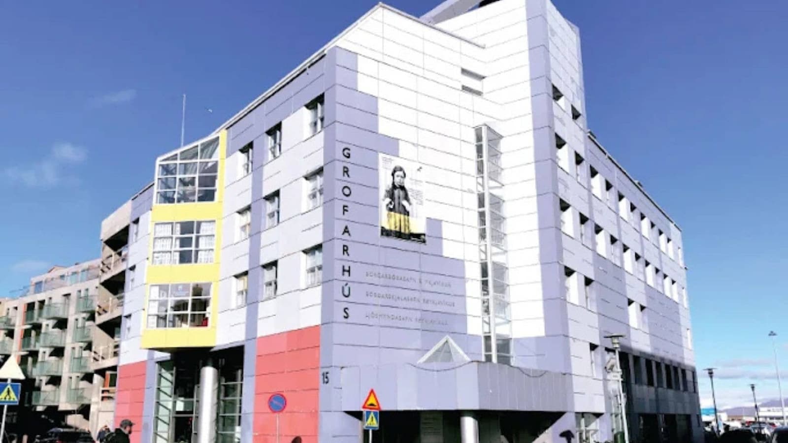 Closer exterior view of Grófarhús and the Reykjavik City Library entrance area.