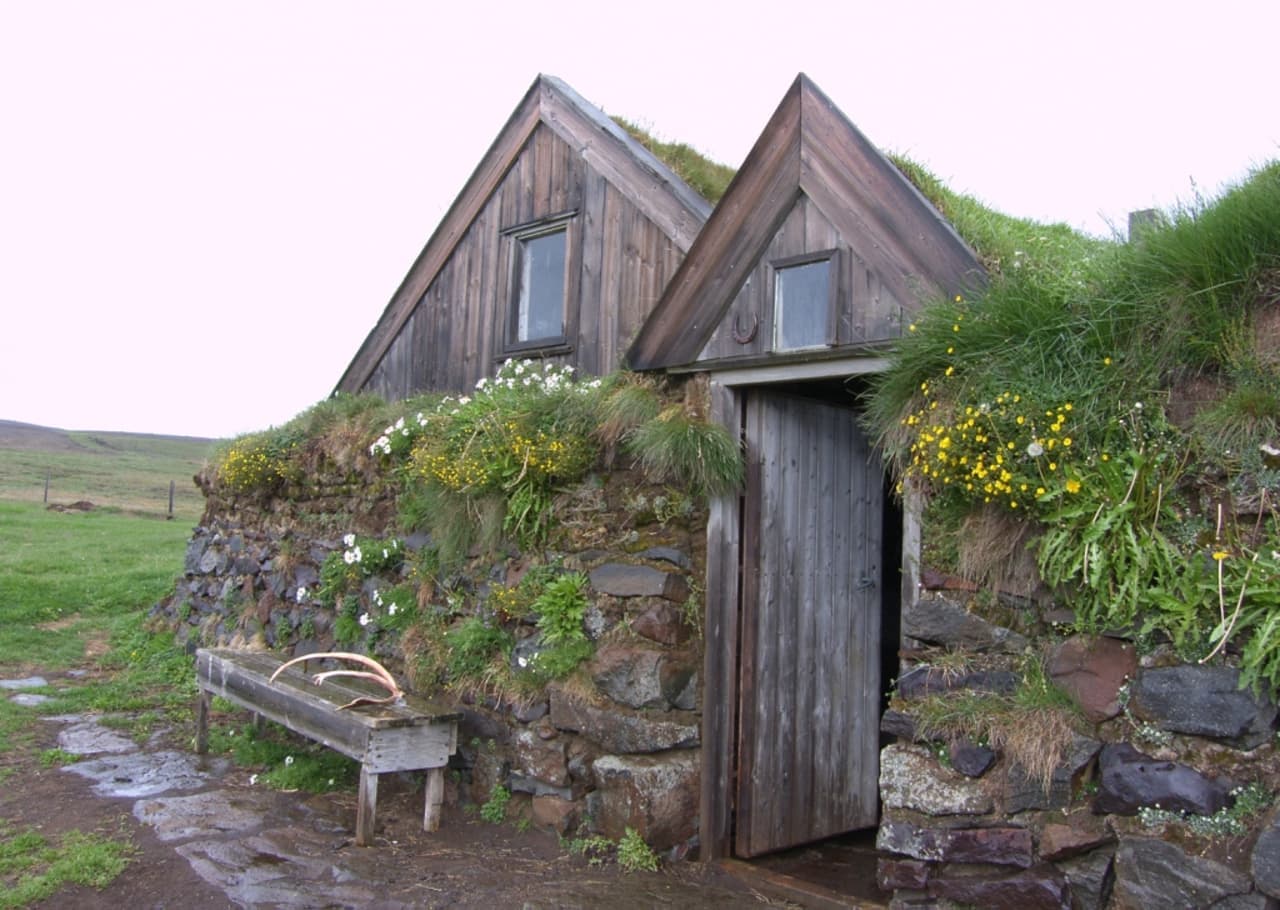 Turf wall and timber doorway detail at Sænautasel beside Saenautavatn in East Iceland.
