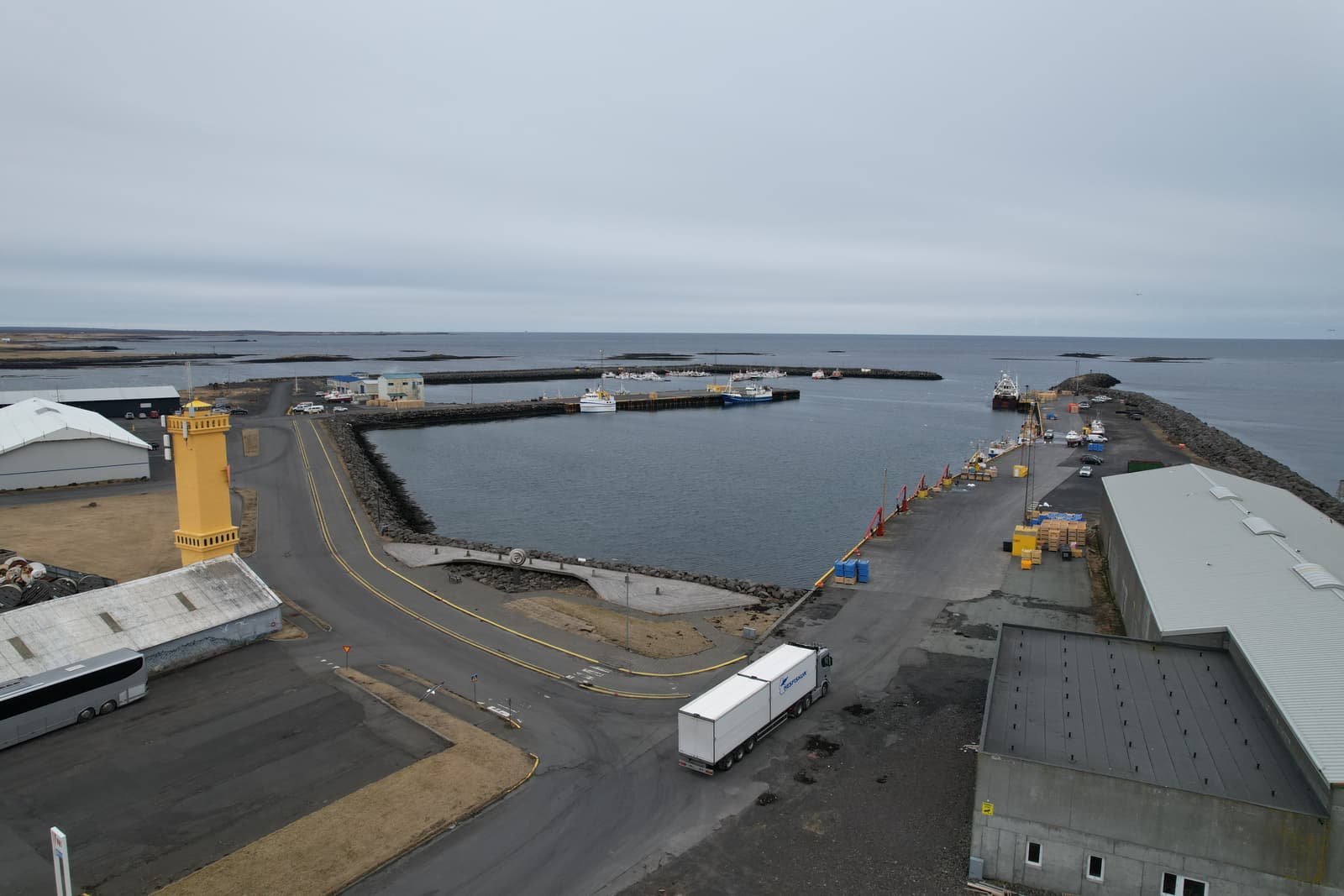 Wide view of Sandgerðishöfn harbor and boats in Sandgerði.