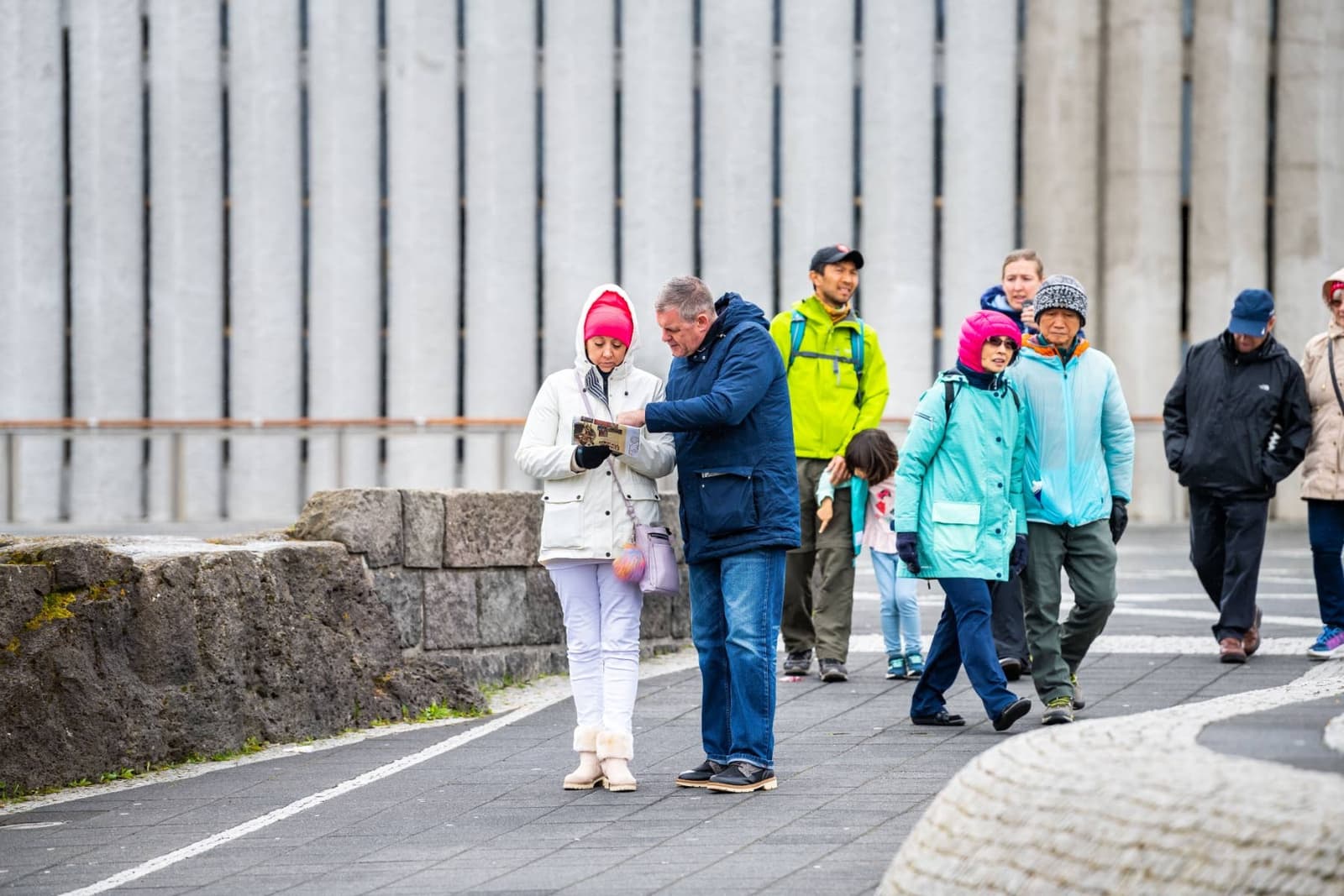 Bundled walkers near Skólavörðustígur in Reykjavík on a cold day.