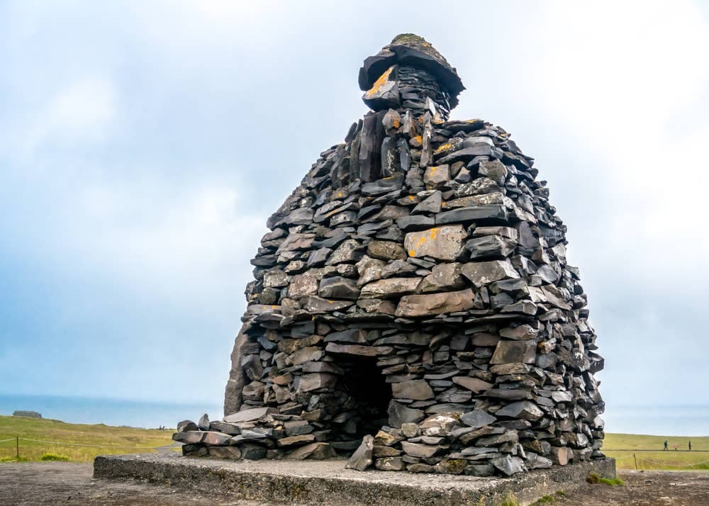 The stone Bárður Snæfellsás sculpture standing near Arnarstapi below Stapafell.