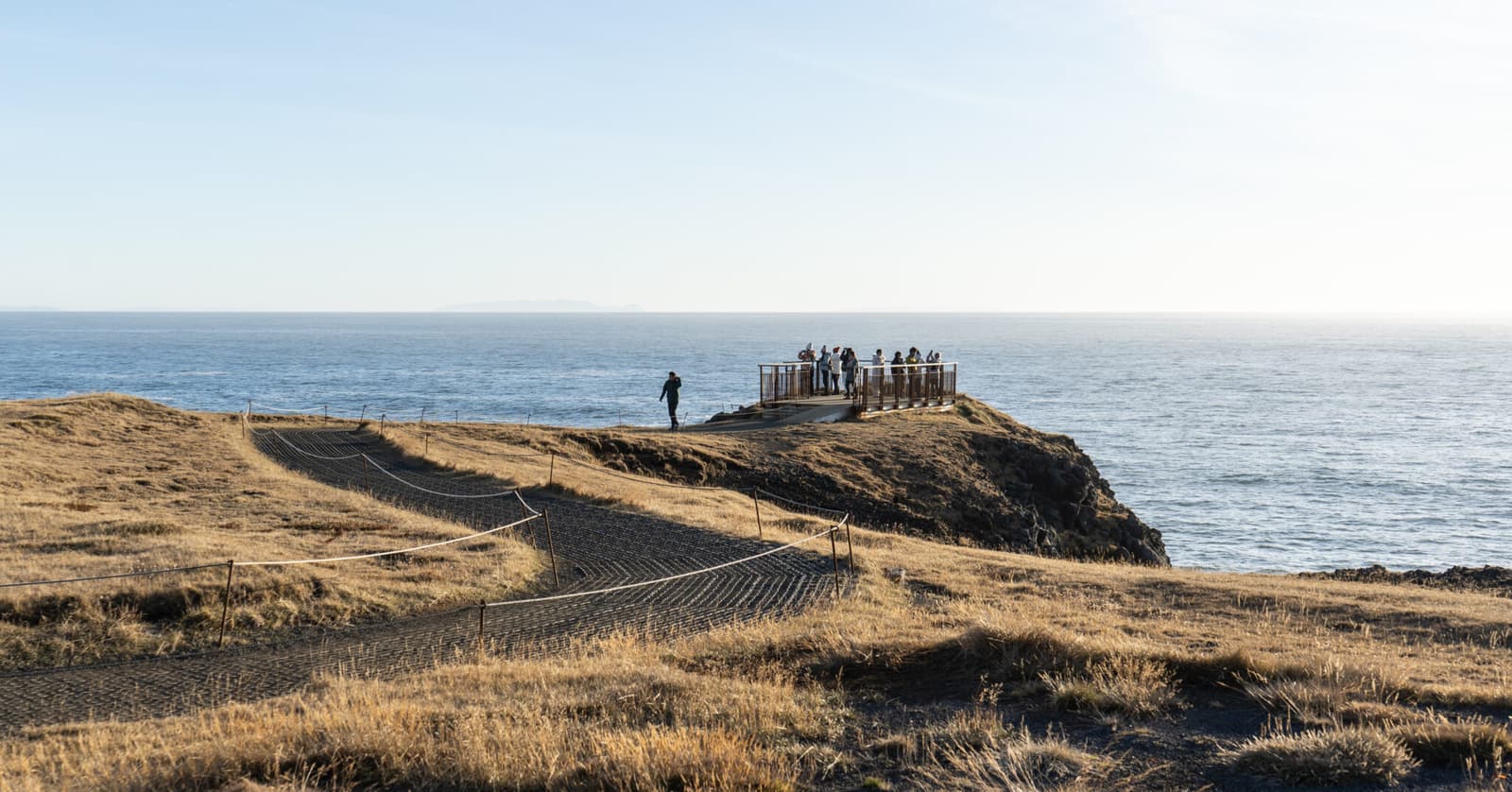 Marked coastal walking path near Arnarstapi and Hellnar above the Atlantic cliffs.