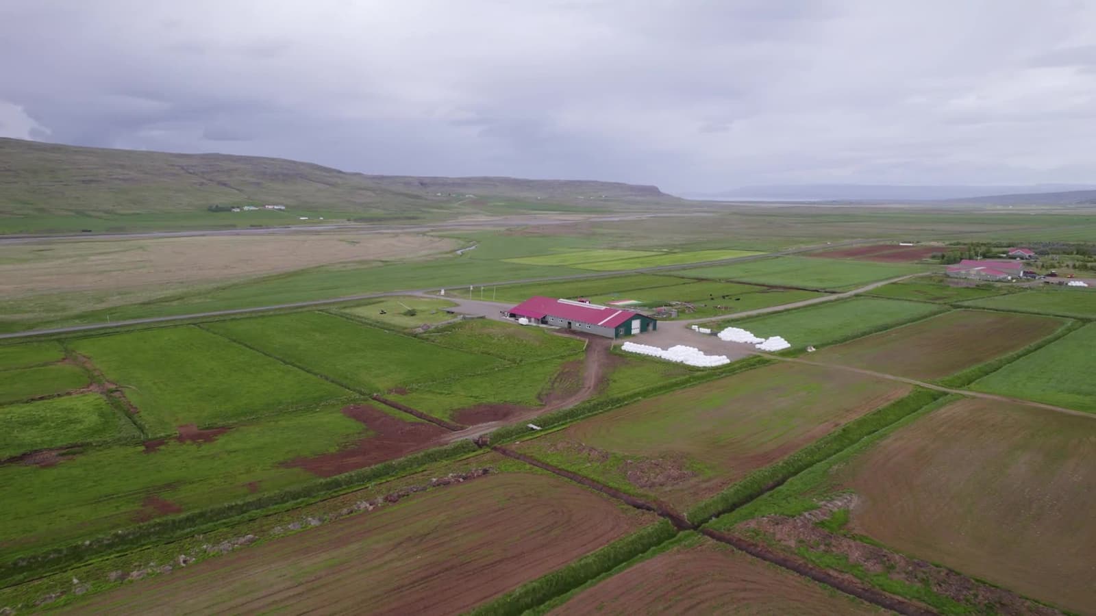 Aerial view of Erpsstaðir farm and creamery in the green West Iceland valley.