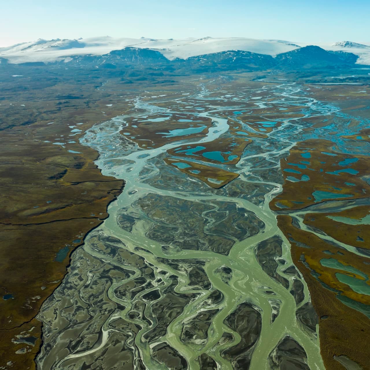 Aerial view of braided glacial water and wetland ponds across Eyjabakkar in East Iceland.