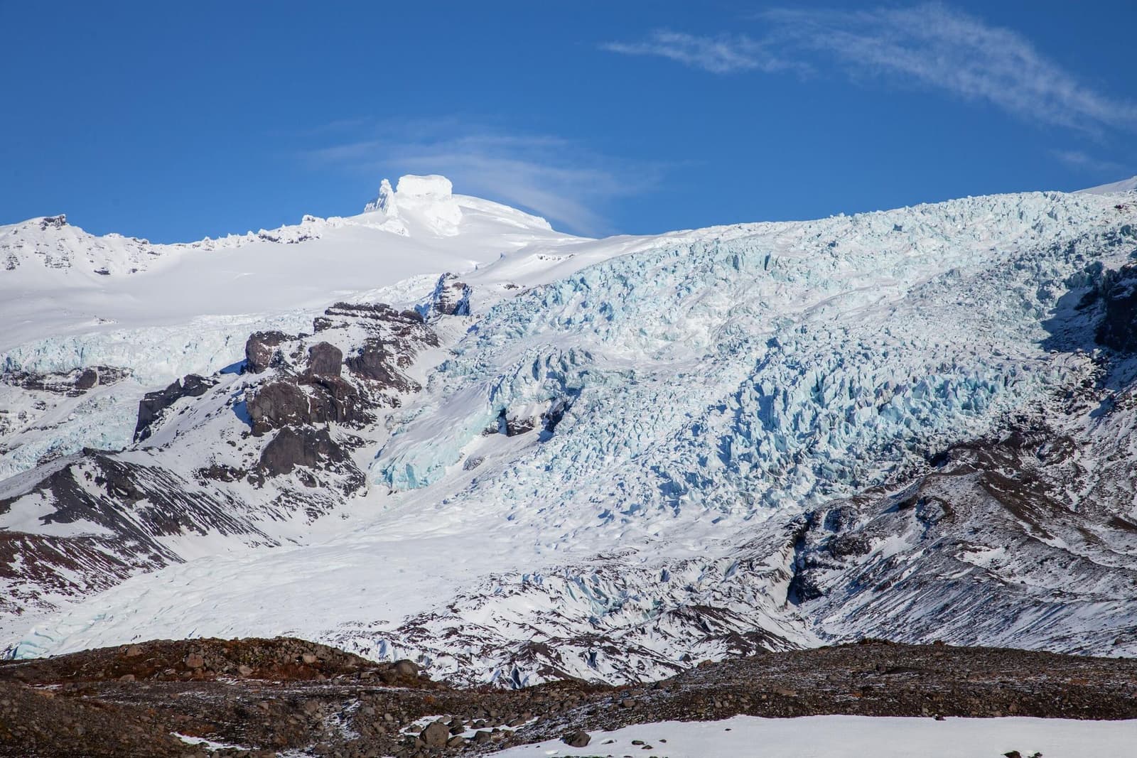Wide winter view of Falljökull Glacier descending from Öræfajökull in southeast Iceland.