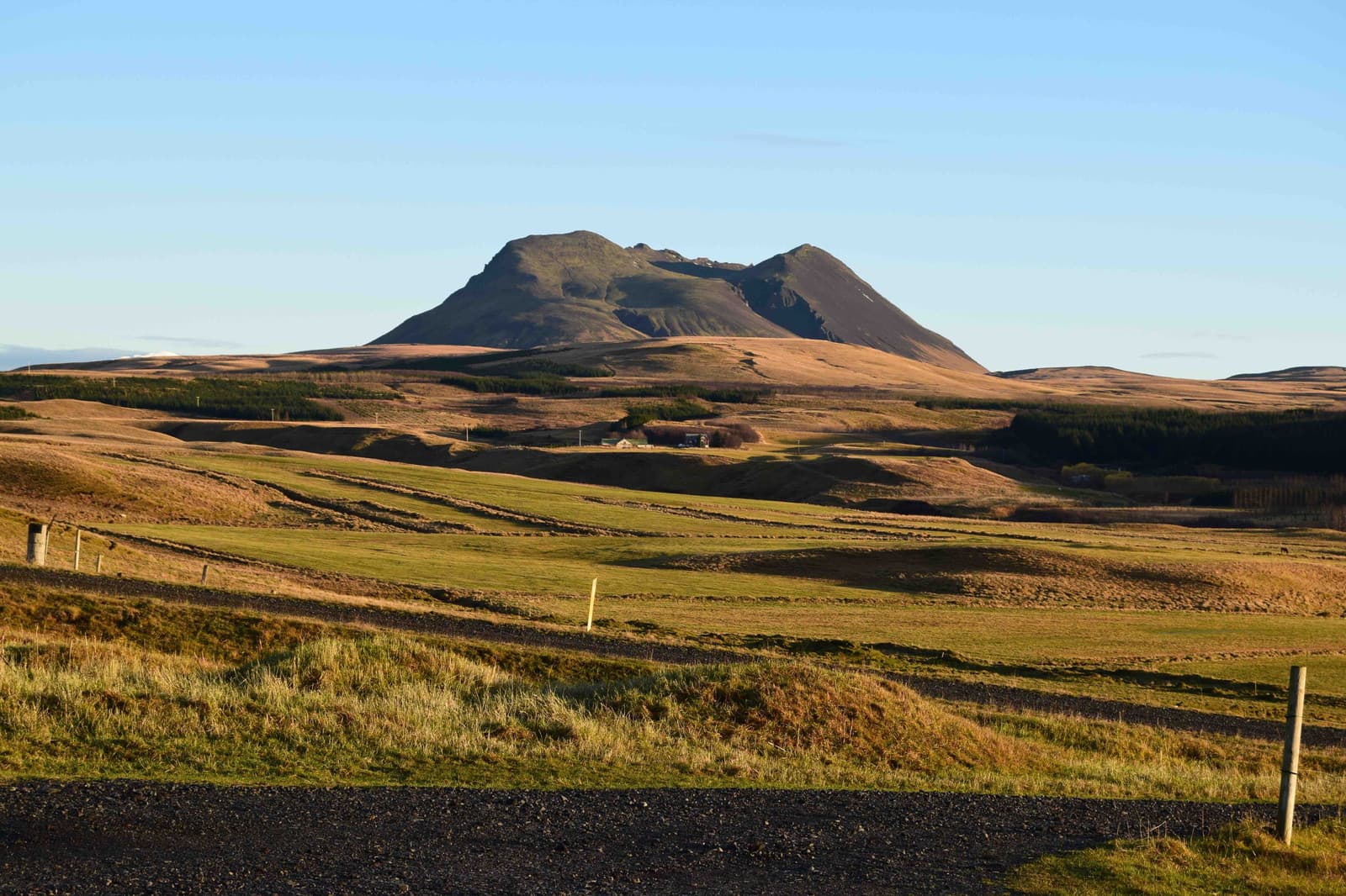 Hlíðarendi hills and farm fields in the Fljótshlíð district of South Iceland.