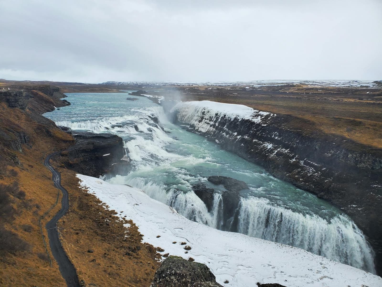 Gullfoss Waterfall dropping through a snowy canyon on the Golden Circle.
