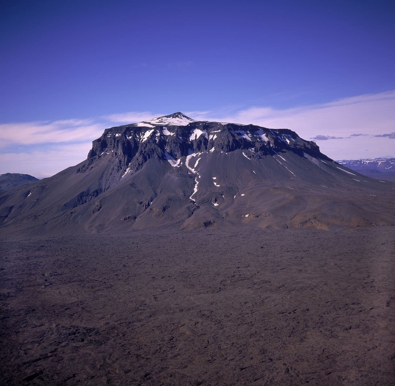 Herðubreið rising above the dark Ódáðahraun lava desert in the north Icelandic Highlands.
