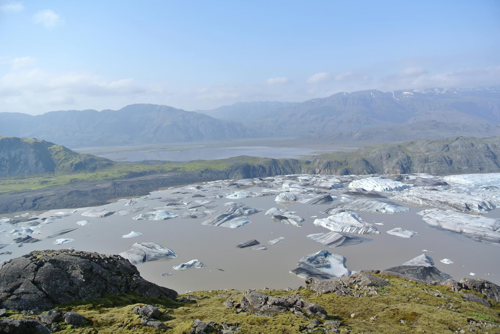 Hoffellslón and Hoffellsjökull beneath broad mountain slopes in southeast Iceland.