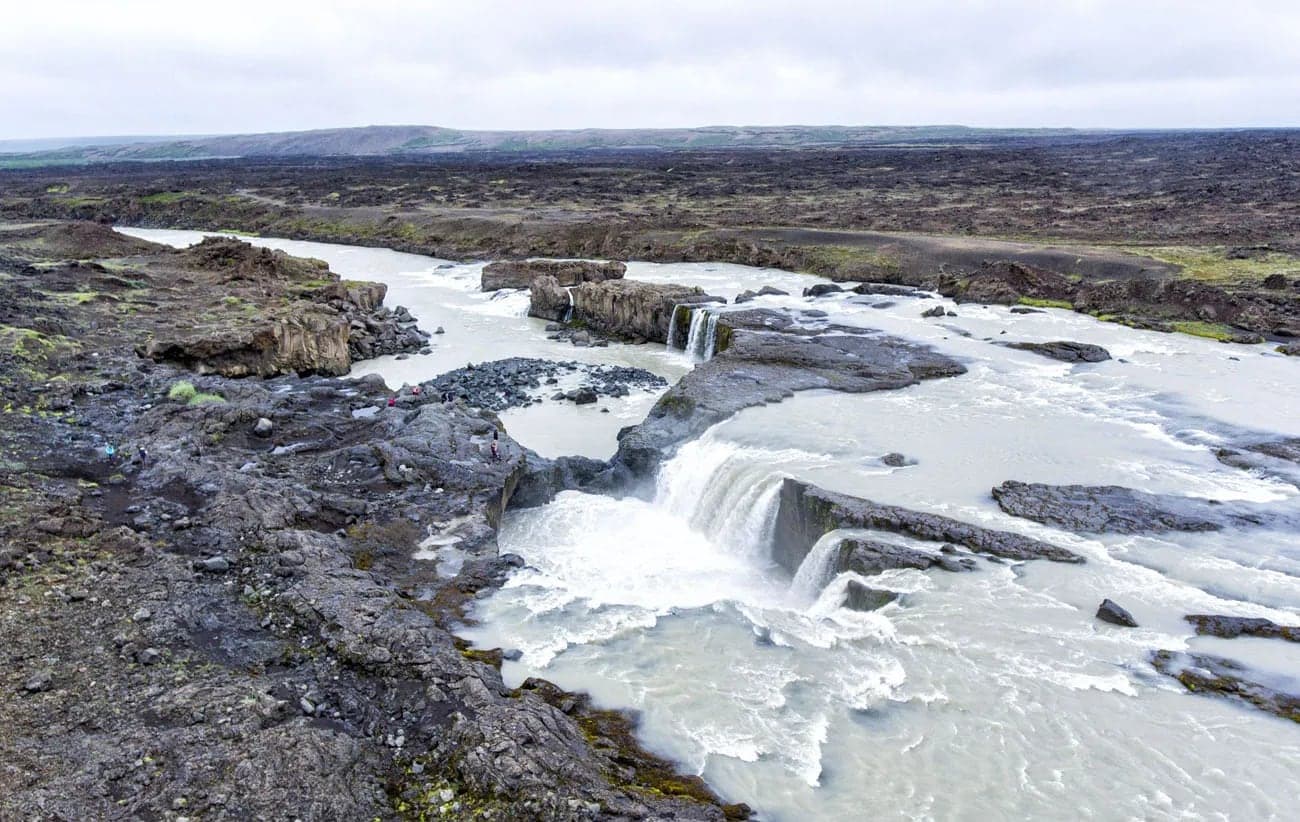 Hrafnabjargafoss waterfall dropping through dark rock in the Skjálfandafljót river corridor.