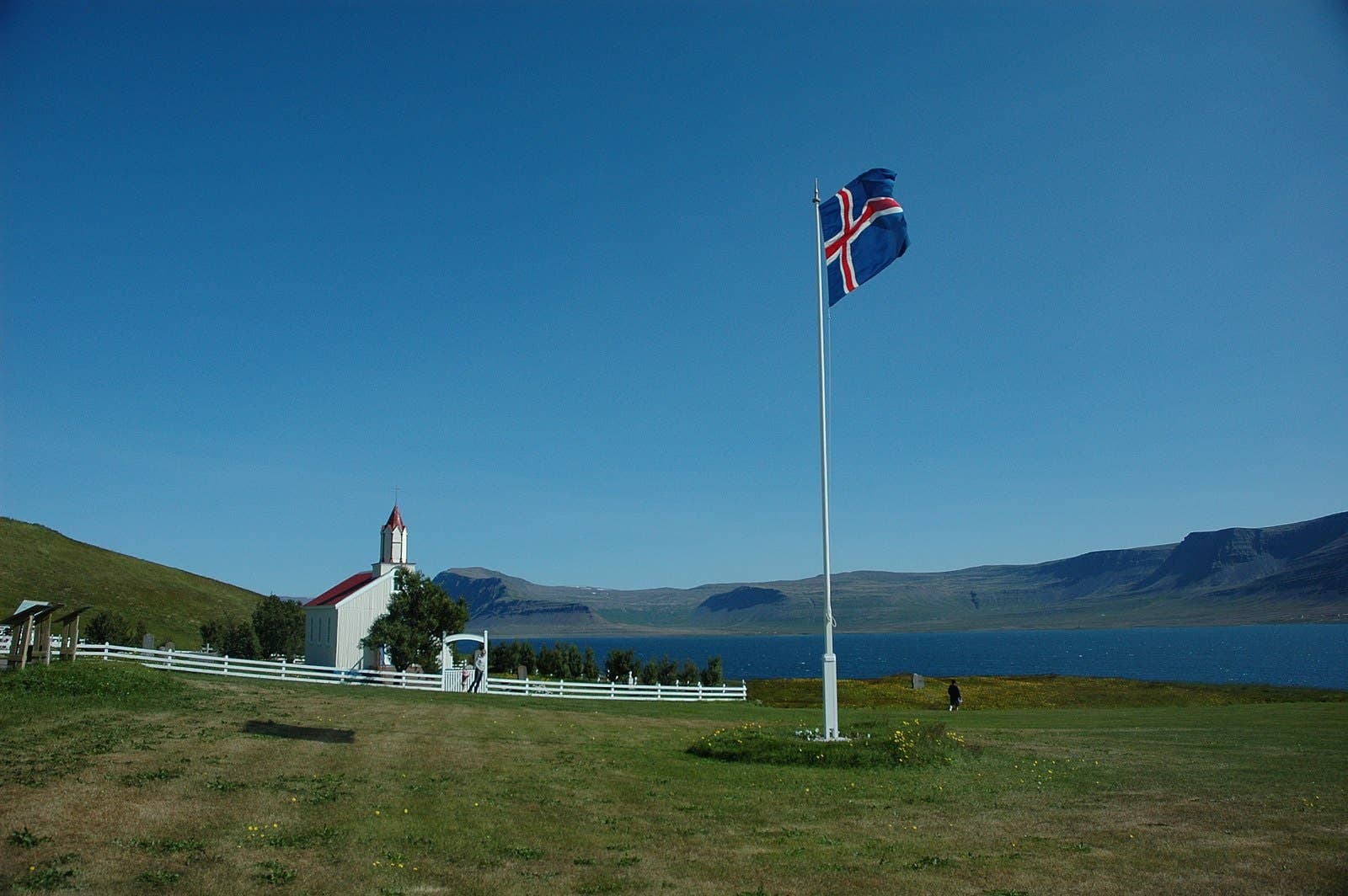 Hrafnseyri church and Icelandic flag beside Arnarfjörður in the Westfjords.