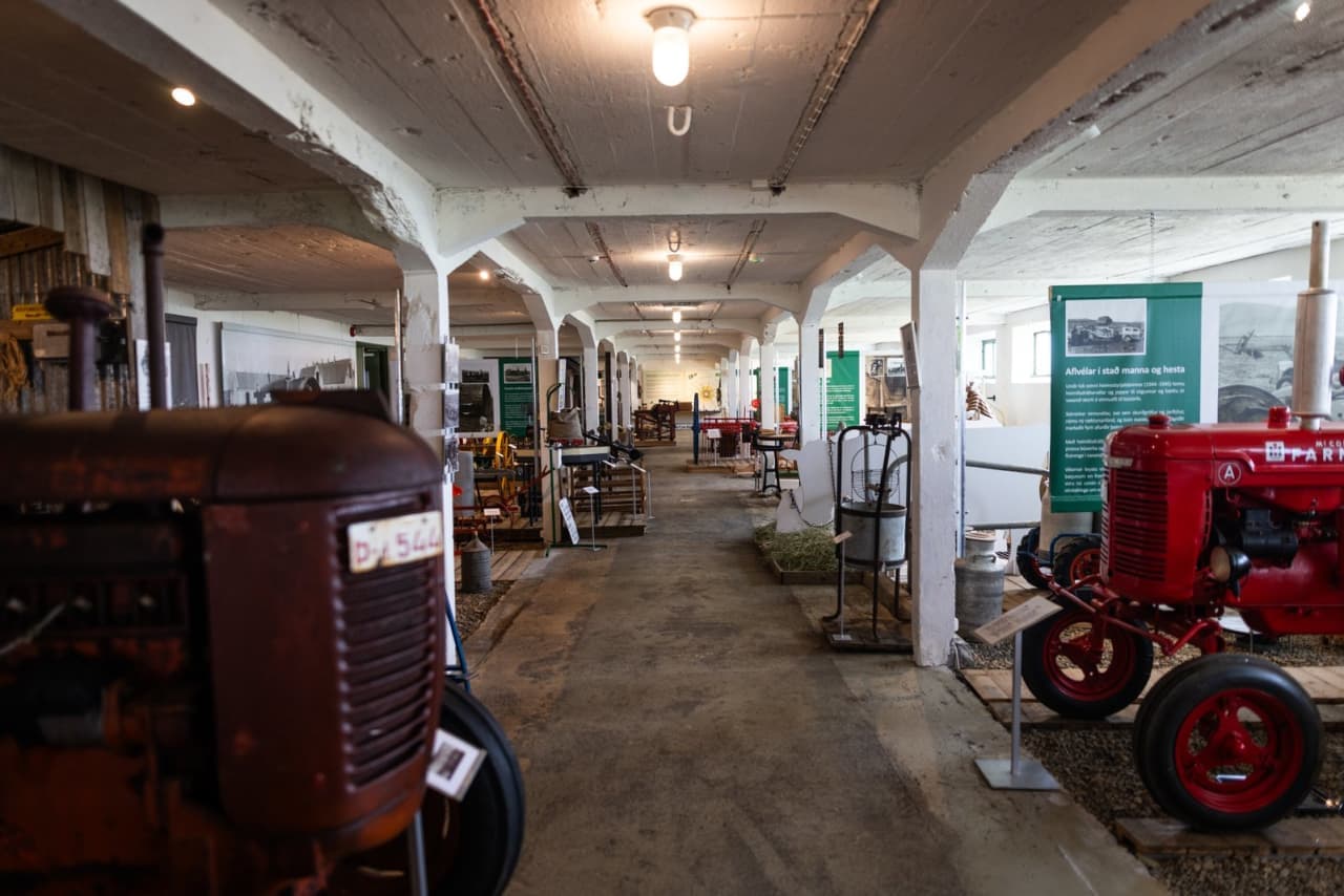 Old tractors and farming equipment inside the Agricultural Museum of Iceland in Hvanneyri.