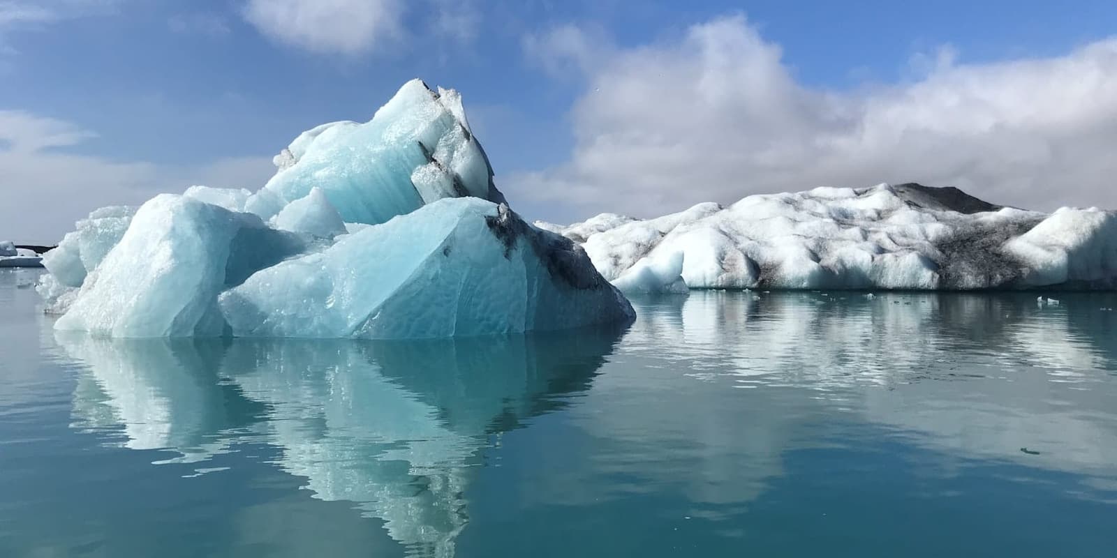 Travelers exploring an icy glacier in Iceland