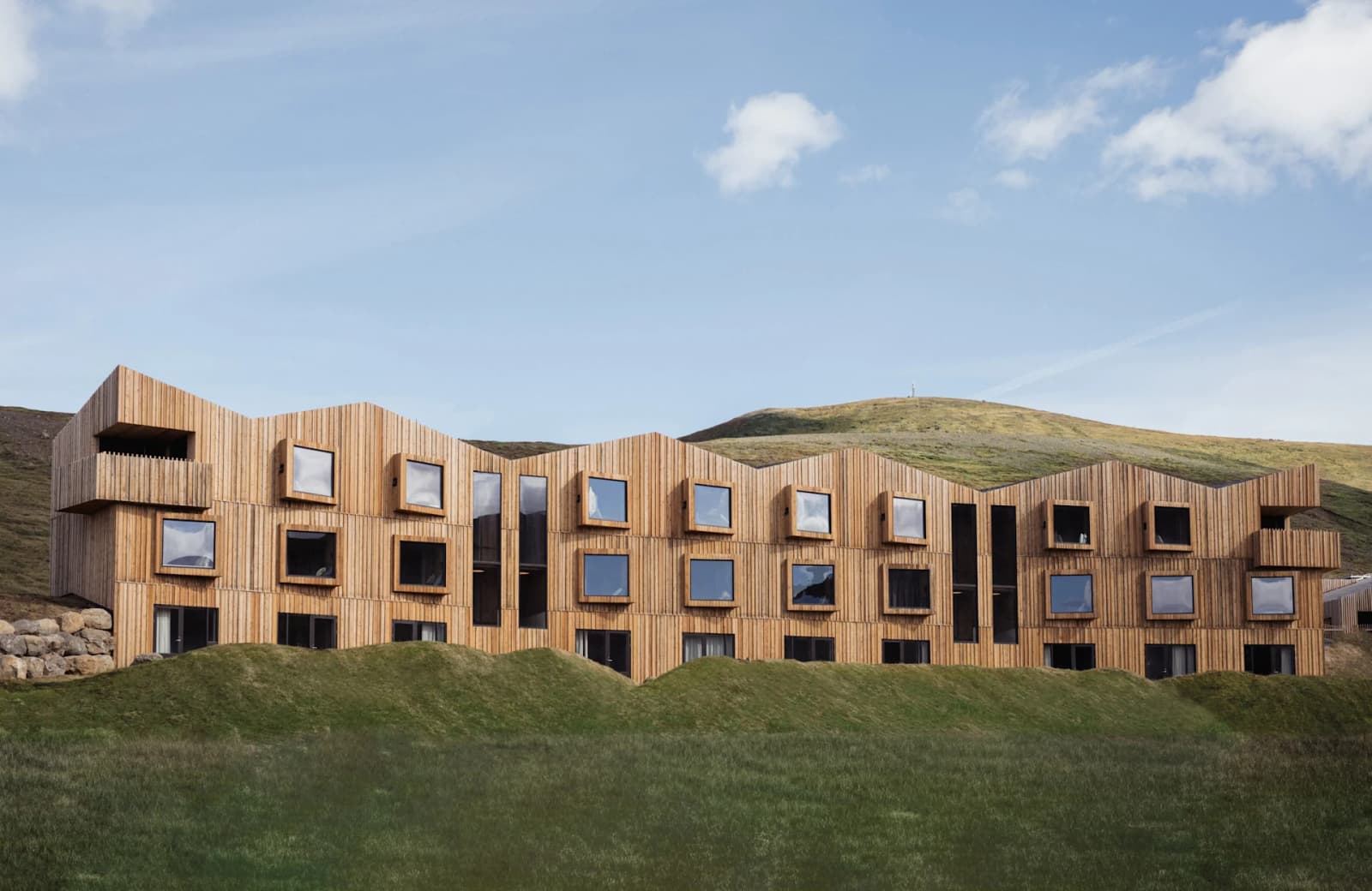 Highland Base buildings at Kerlingarfjöll with mountains and highland terrain behind them.