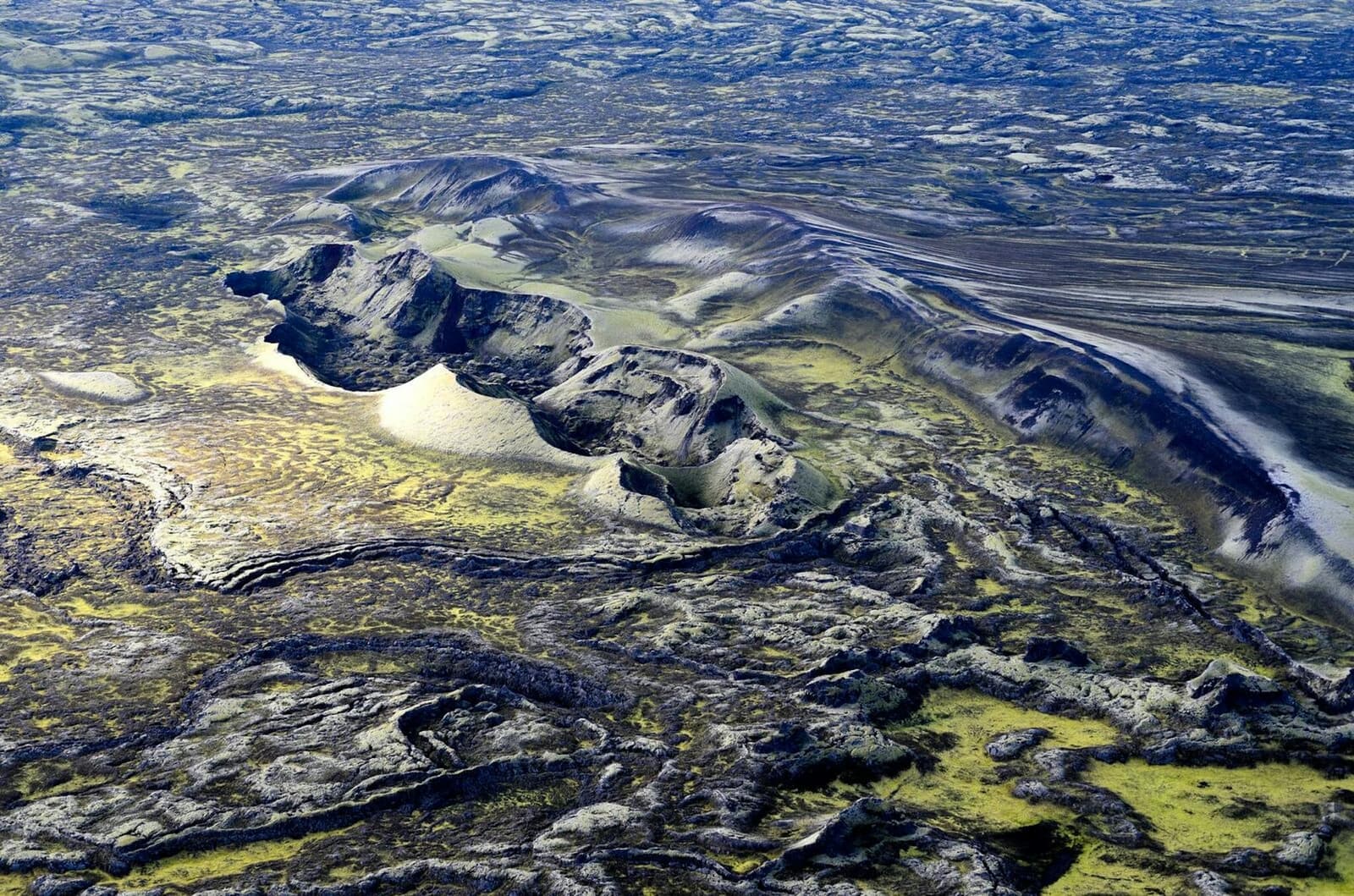 Aerial view of Lakagígar with moss-covered crater rows stretching through the South Iceland Highlands.