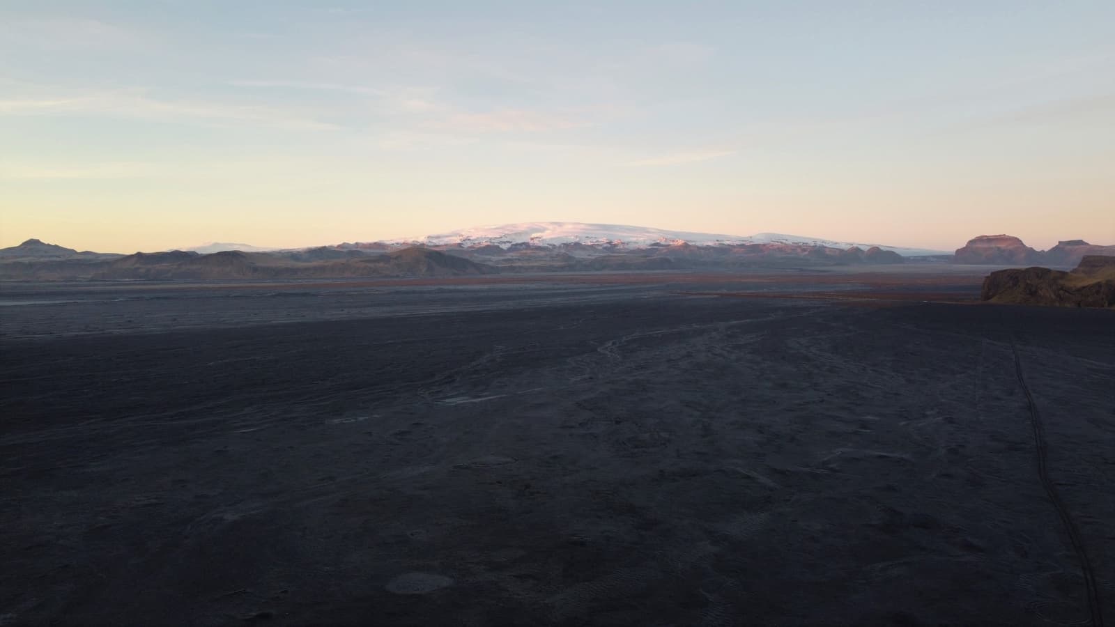 Wide black Mýrdalssandur outwash plain below Mýrdalsjökull and Hjörleifshöfði on Iceland’s South Coast.