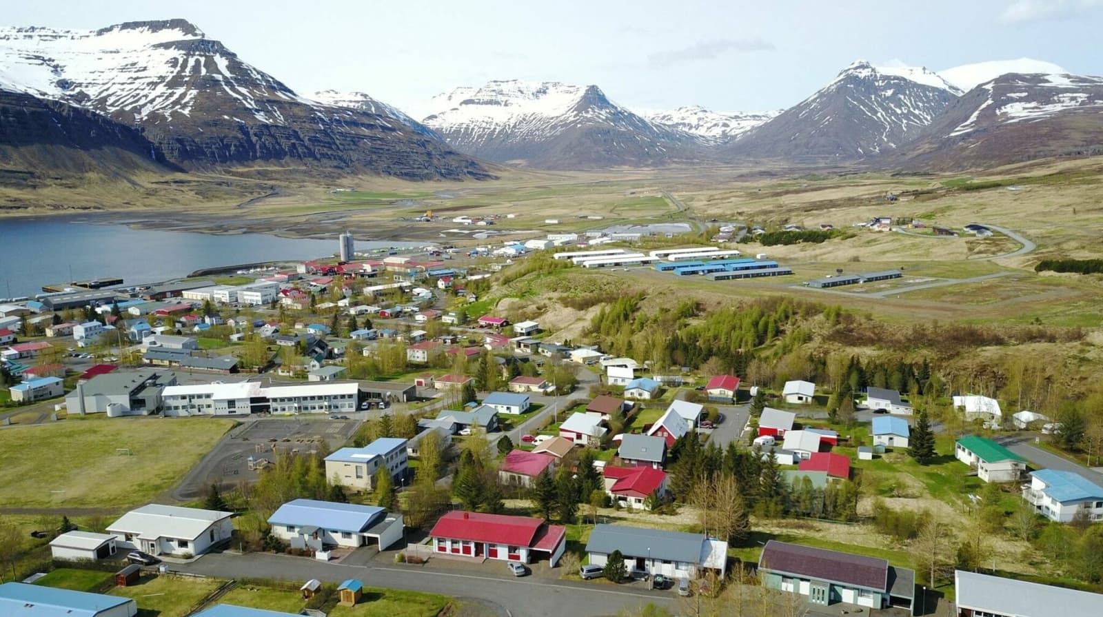 Aerial view of Reyðarfjörður spread along the broad fjord in East Iceland.
