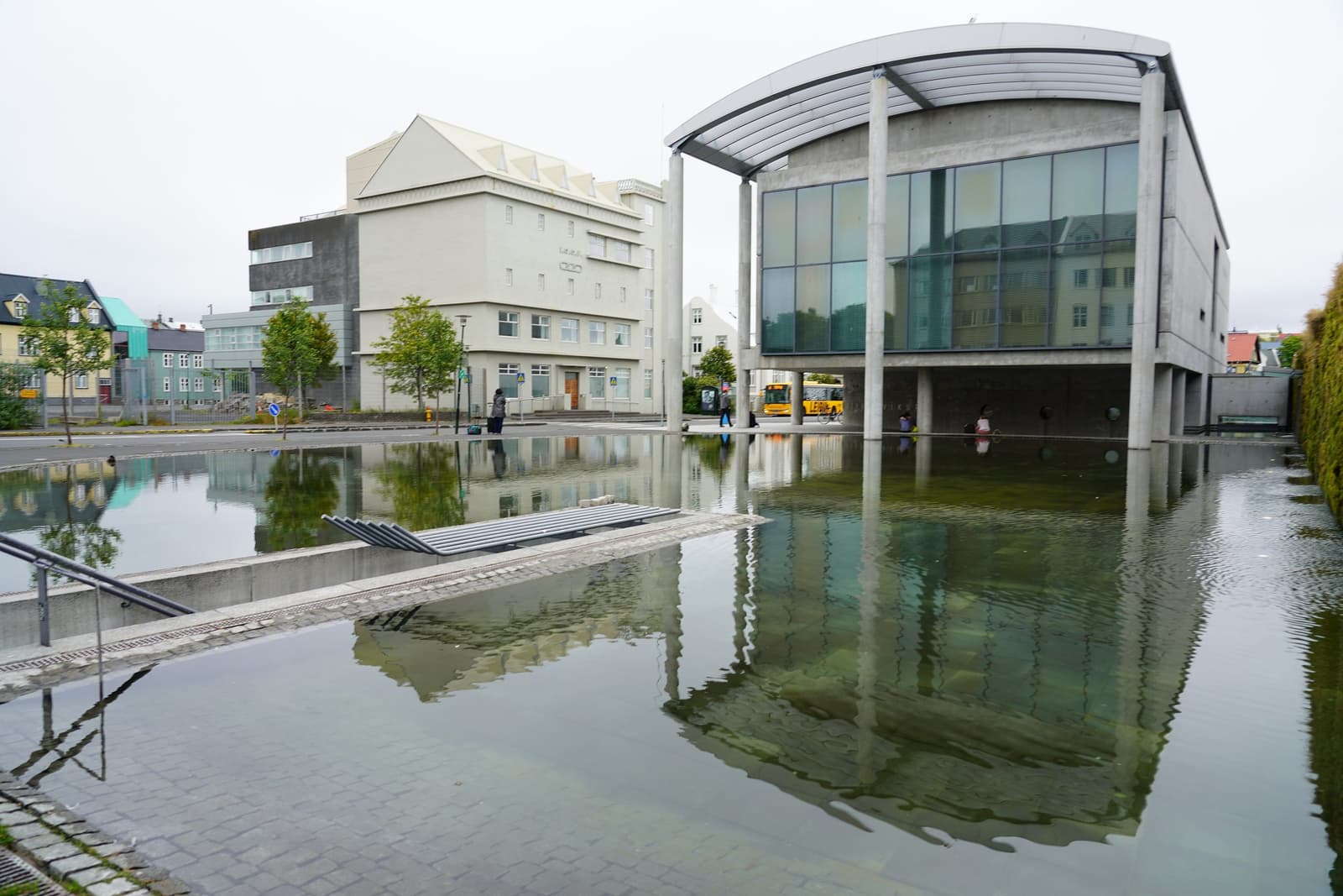 Reykjavík City Hall beside Tjörnin with modern concrete and glass reflected in water