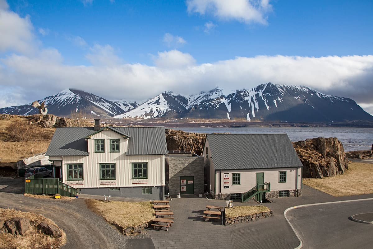 The Settlement Center buildings in Borgarnes with Hafnarfjall mountain across the water.