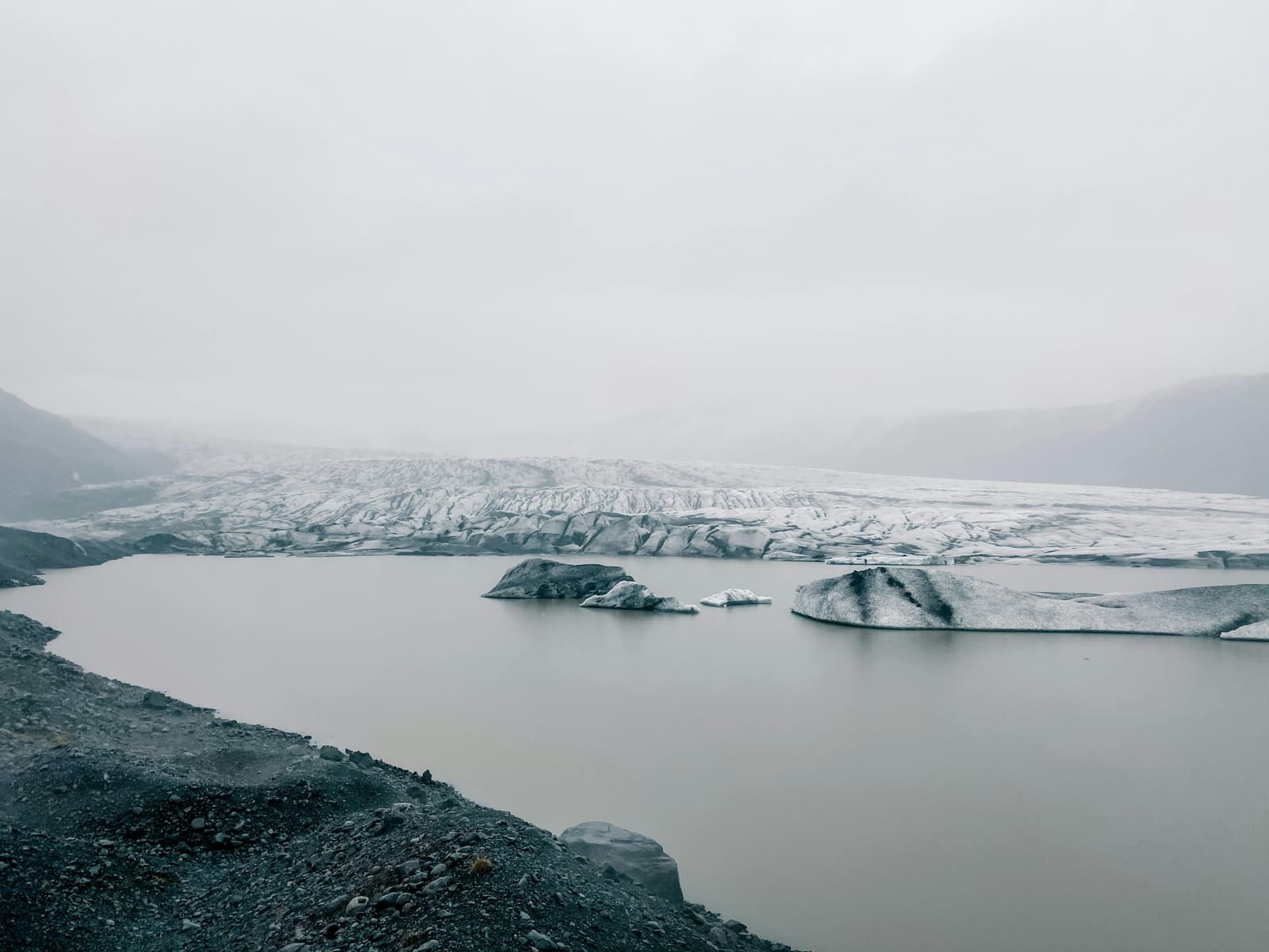 Skálafellsjökull glacier above dark moraine near the Hjallanes walking route.