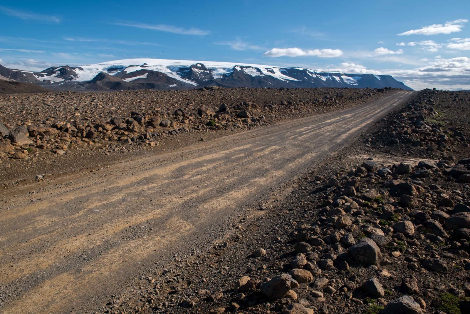Þórisjökull glacier above rough Kaldidalur road and dark highland ground.