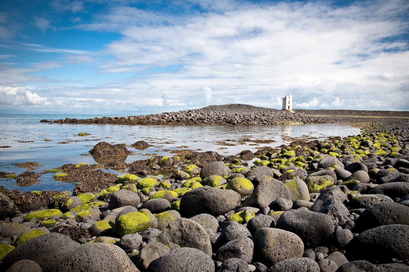 Hafnarnesviti lighthouse on the rocky coast south of Þorlákshöfn.