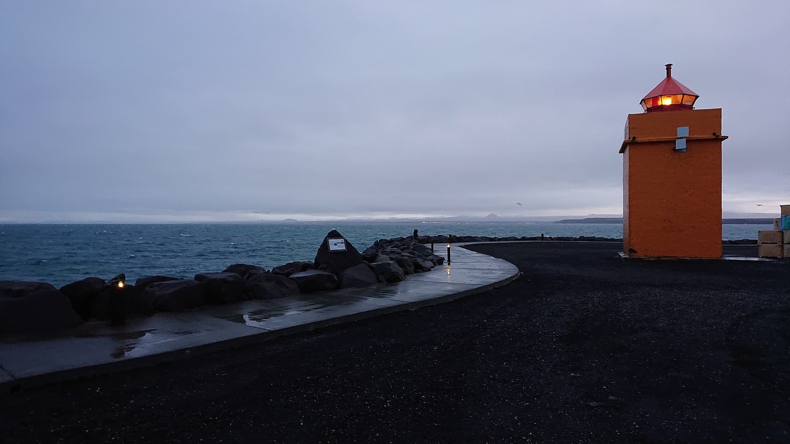 Orange harbor lighthouse on the Vatnsnes coast in North Iceland