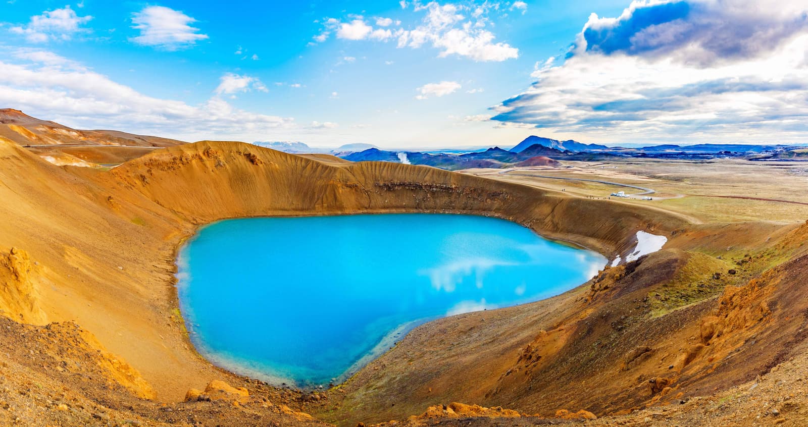 Blue-green water inside Víti crater in the Krafla volcanic area near Lake Mývatn.