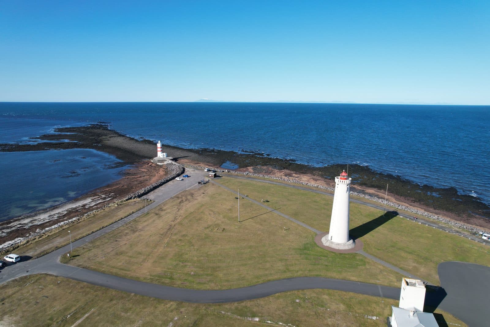Garðskagaviti lighthouse standing on the low Reykjanes coast at Garðskagi.