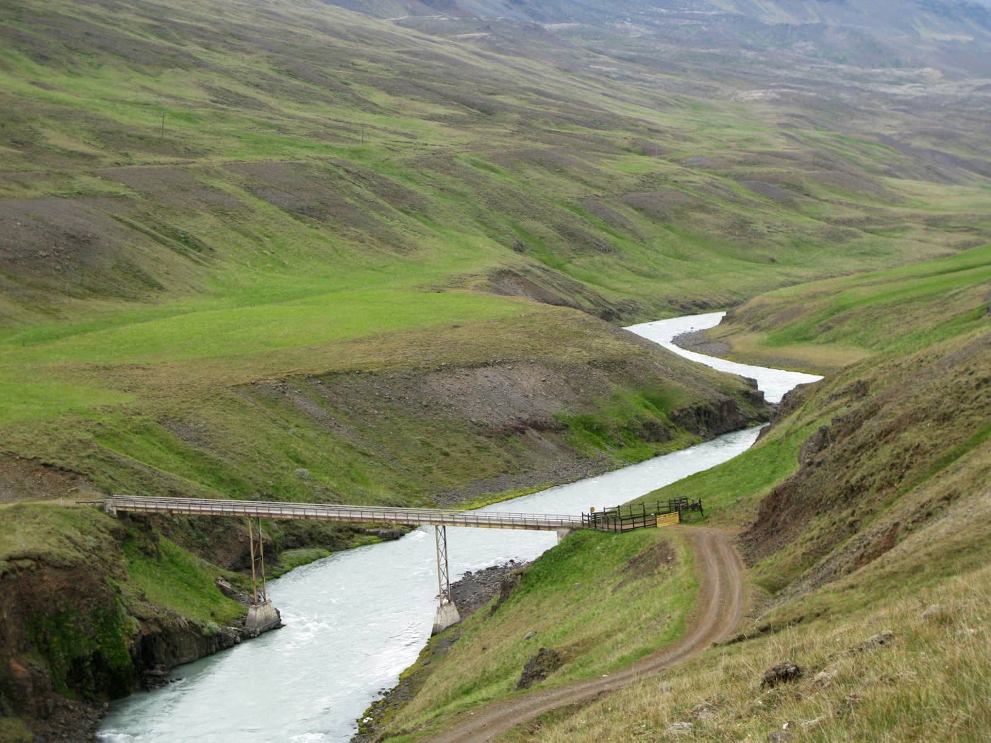 Moníkubrú bridge crossing the pale Austari-Jökulsá river in Austurdalur valley.