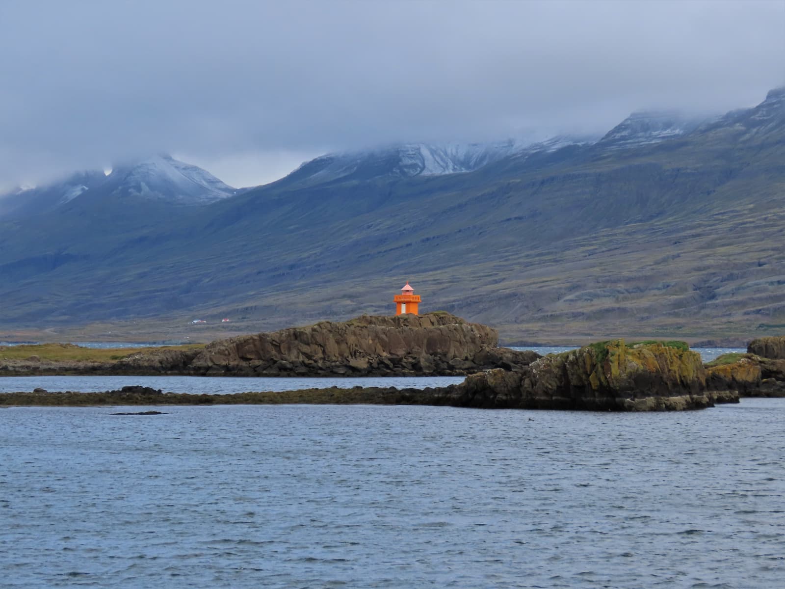 Djúpivogur Lighthouse on the shoreline west of the harbor in East Iceland.