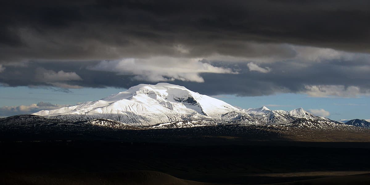 Eyjabakkajökull glacier under dark clouds in the remote East Iceland highlands.