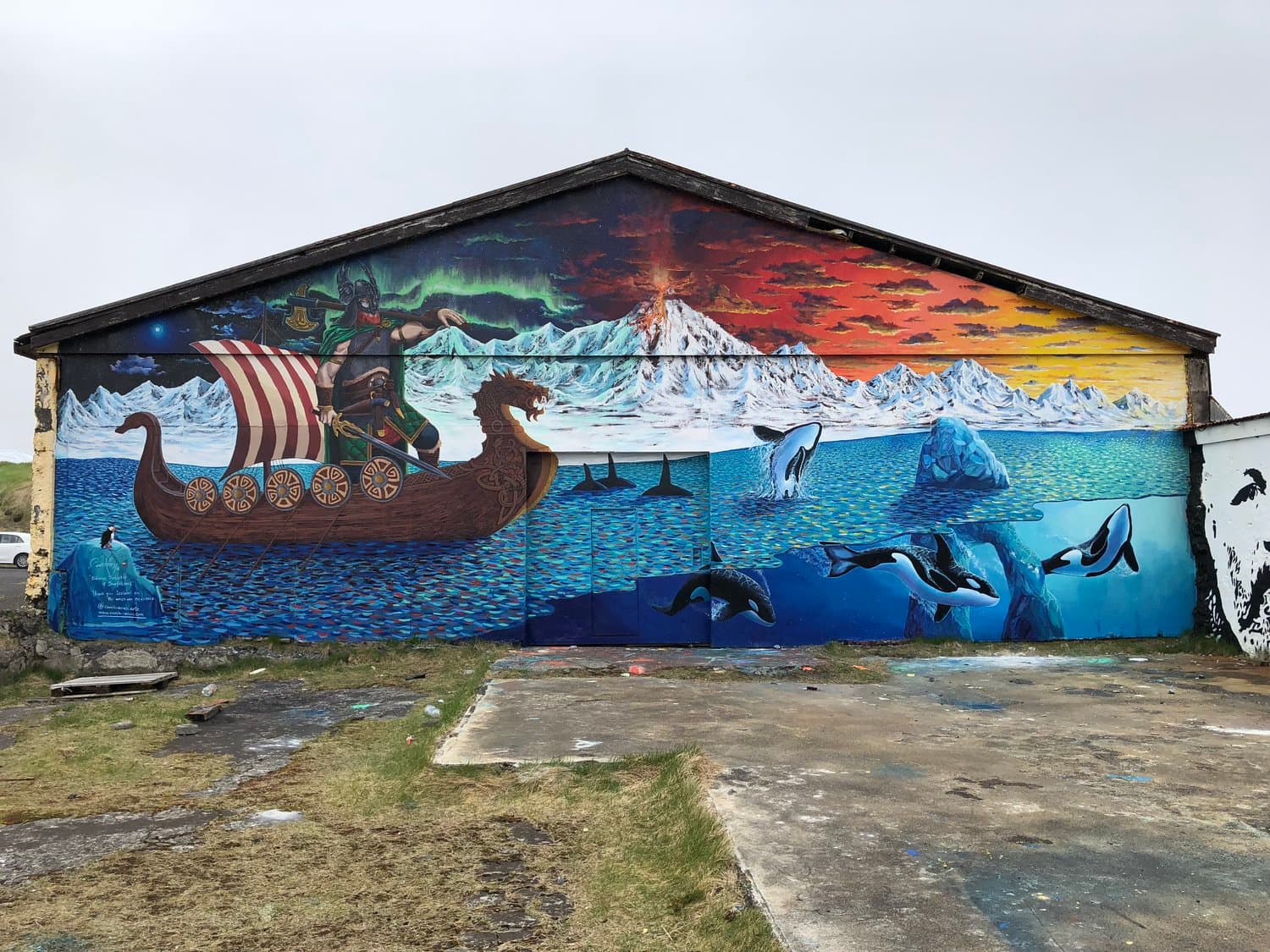 Large Viking ship and glacier mural painted on an old building in Hellissandur.