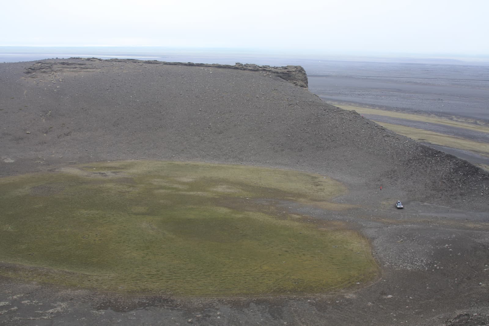 Hrossaborg crater wall and mossy interior on a grey North Iceland highland day.