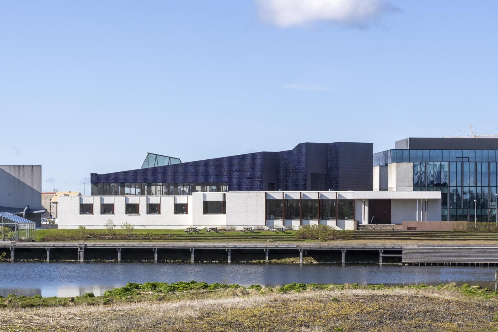 The Nordic House in Reykjavik with its blue Alvar Aalto roof beside the Vatnsmyri wetland.