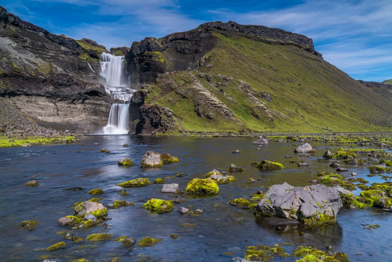 Ófærufoss waterfall dropping in two steps into the rocky Eldgjá canyon.