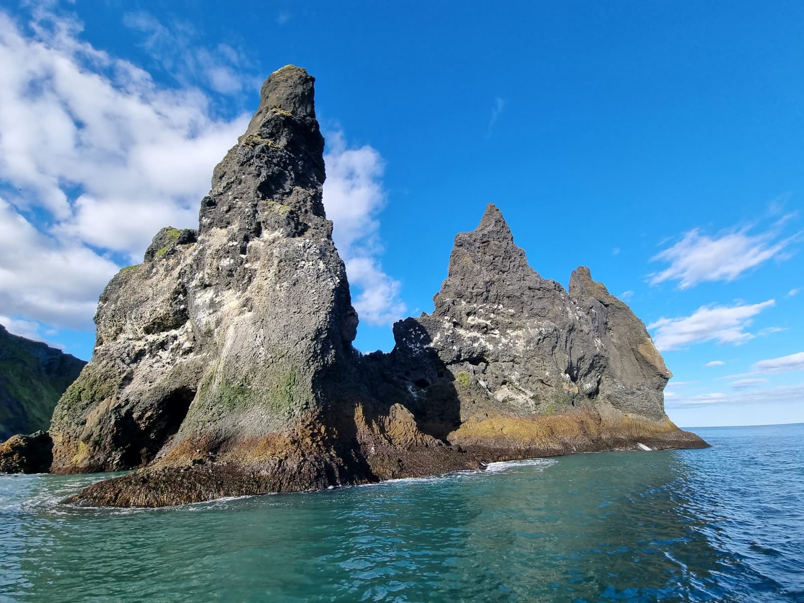 Reynisdrangar basalt sea stacks rising from the Atlantic below Reynisfjall