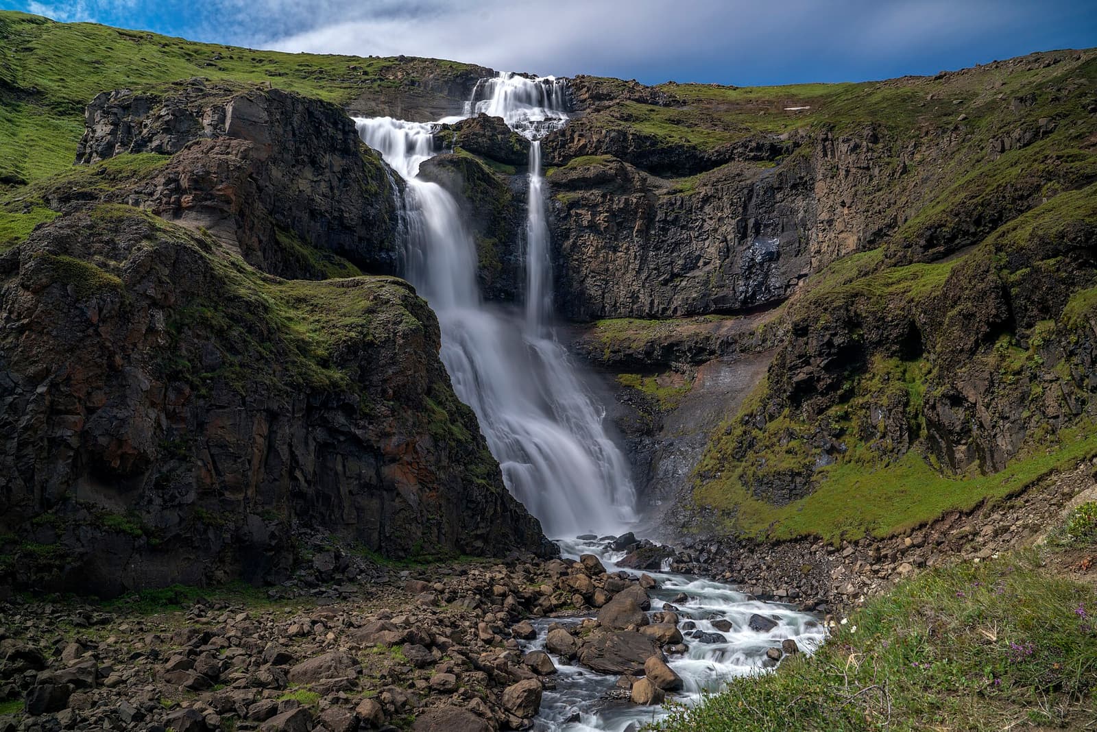 Rjúkandi Waterfall dropping in tiers down the Jökuldalur mountainside in East Iceland.