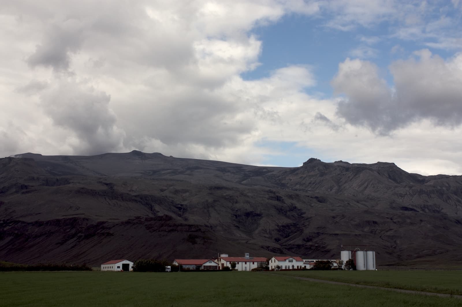 Þorvaldseyri farm below the ash-darkened slopes of Eyjafjallajökull.