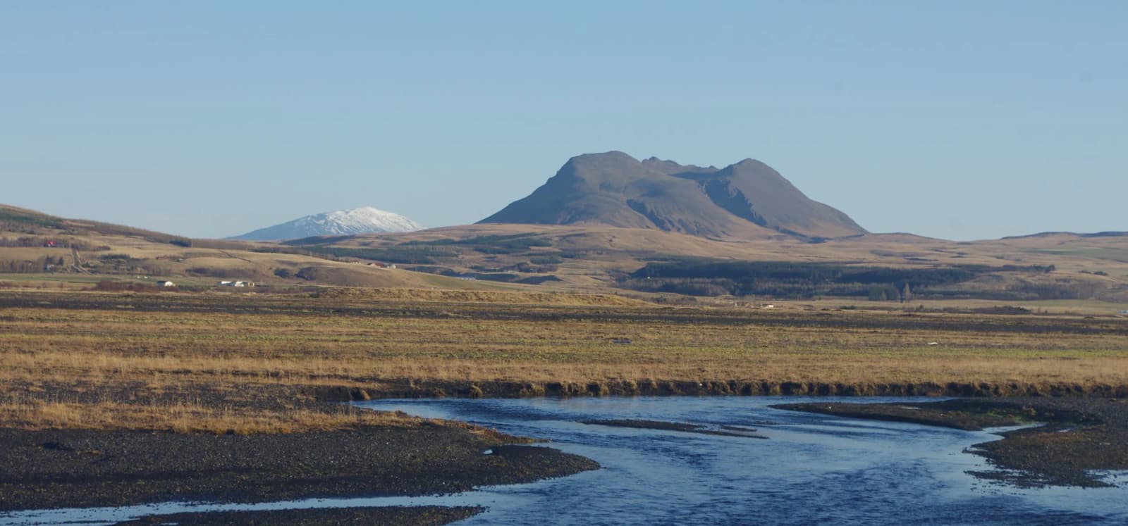 Þríhyrningur mountain rising above the Fljótshlíð countryside in South Iceland.