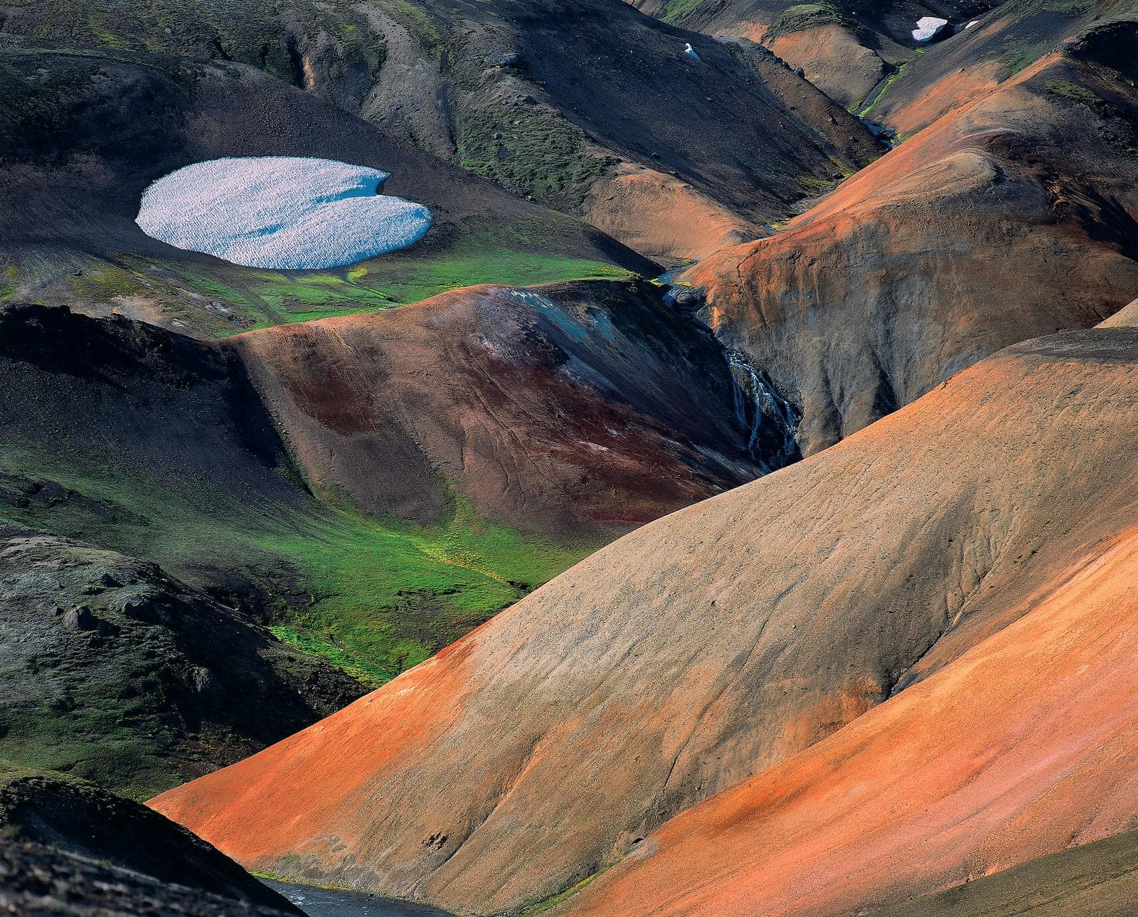Rhyolite slopes and a small glacier patch in the Torfajökull volcanic area.