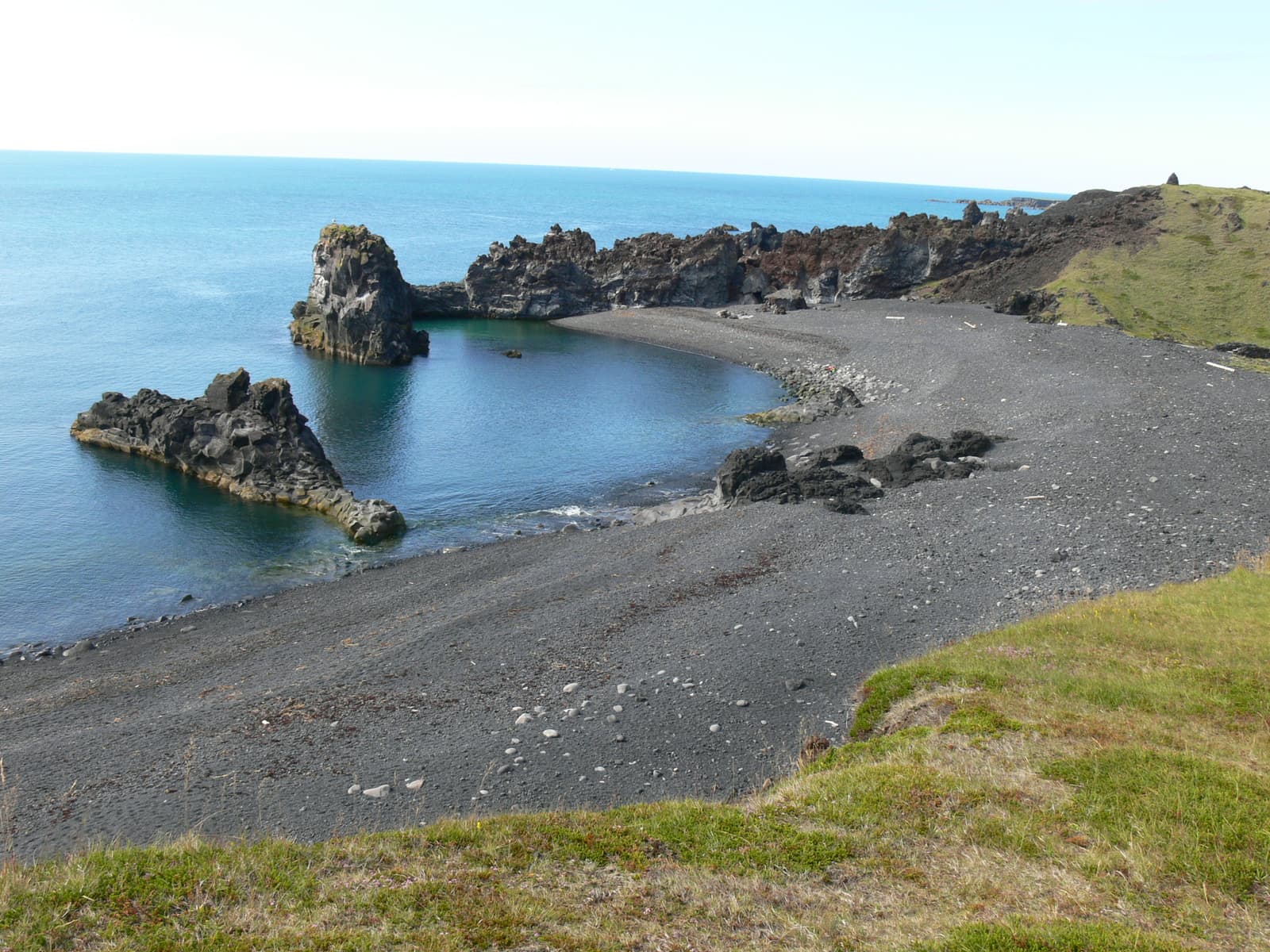Dritvík Cove and black-pebble shore below lava cliffs on Snæfellsnes.