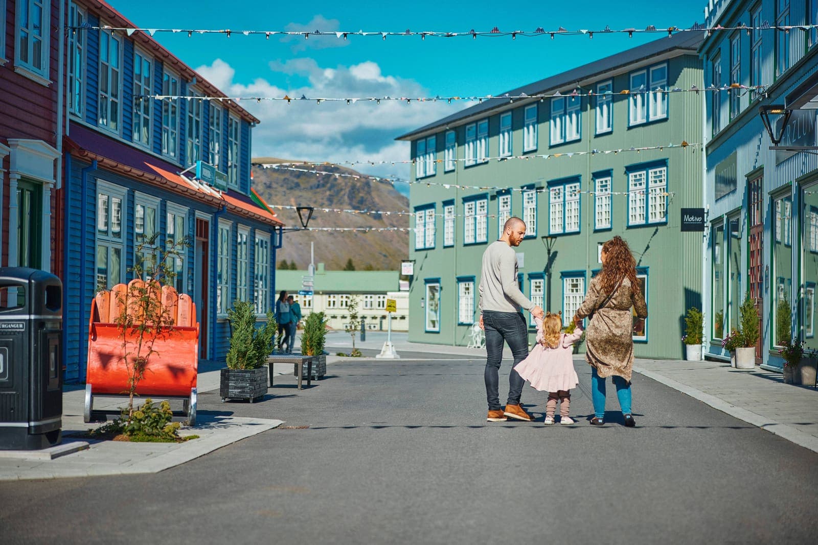 Family walking together during an easy stop on an Iceland trip