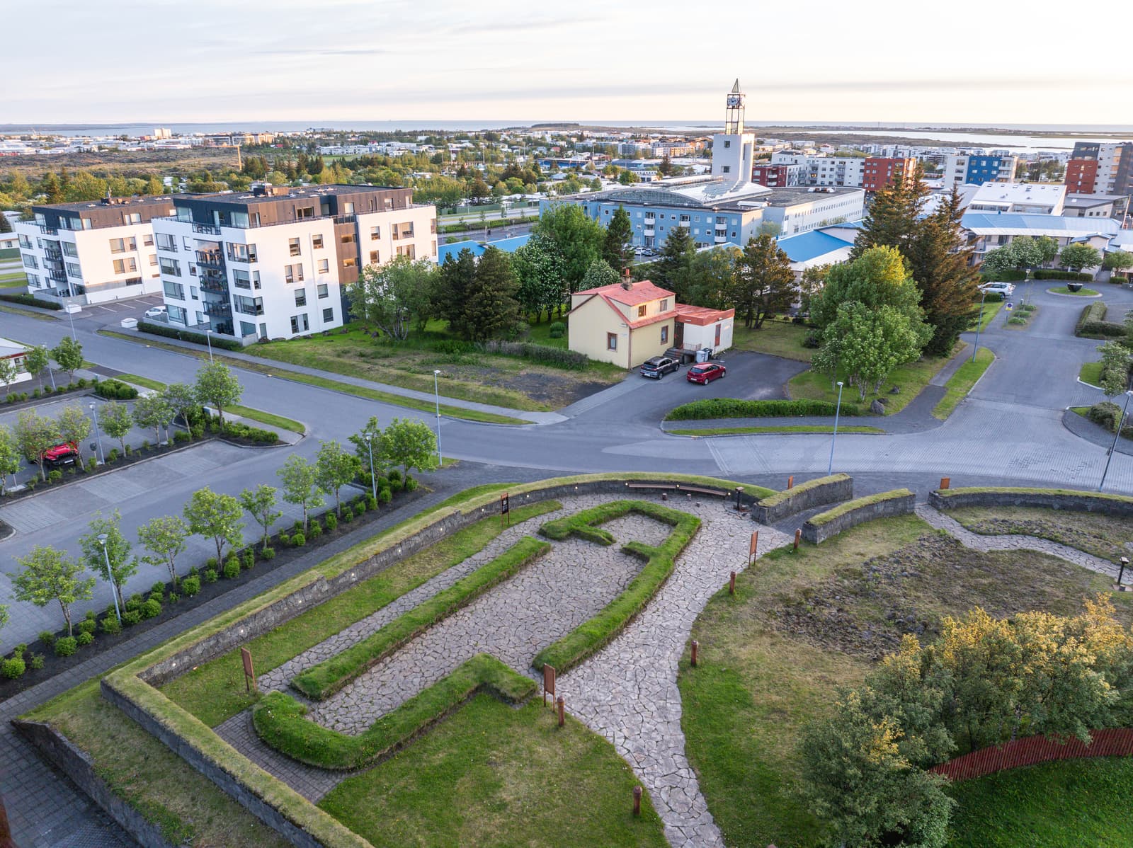 Garðabær town center with Hofsstaðir heritage site in the foreground and the church beyond.