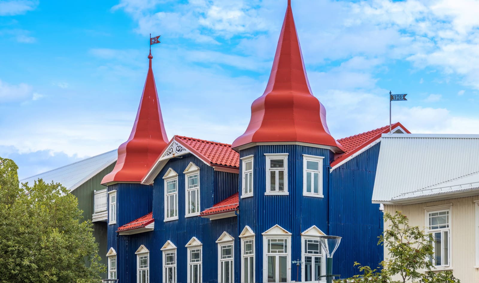 Colorful wooden building in Akureyri under a bright North Iceland sky.