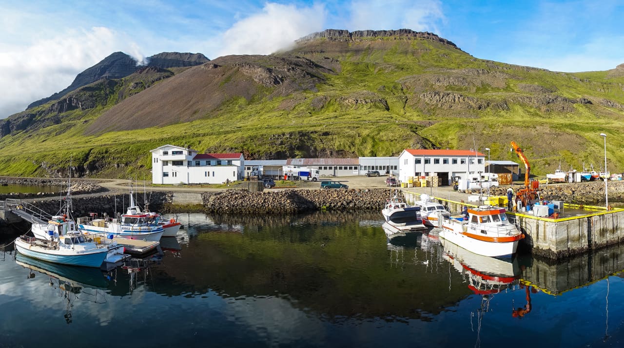 Harbor boats and mountain backdrop in the Gjögur area of Árneshreppur.